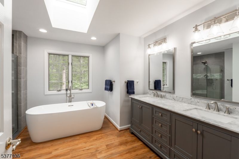 Bathroom, Dual Sink Vanities, Free Standing Baths, Interior, Recessed Lighting, Wood Texture Flooring