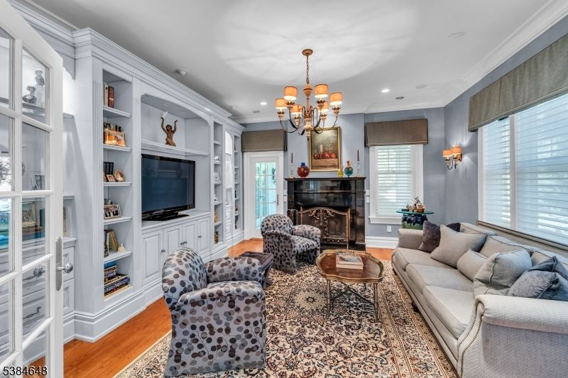 Chandelier, Fireplace, Interior, Living room, Recessed Lighting, Wood Texture Flooring