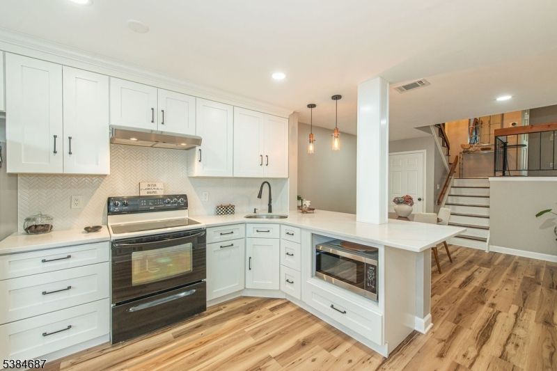 Interior, Kitchen, Pendant Lights, Recessed Lighting, Stainless Steel Appliances, Wood Texture Flooring