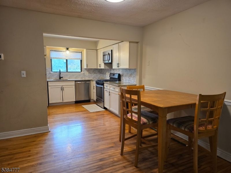 Dining room, Interior, Kitchen, Stainless Steel Appliances, Wood Texture Flooring