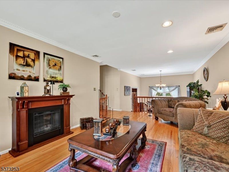 Chandelier, Dining room, Fireplace, Interior, Living room, Recessed Lighting, Wood Texture Flooring