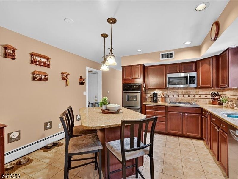 Dining room, Interior, Kitchen, Pendant Lights, Recessed Lighting, Stainless Steel Appliances