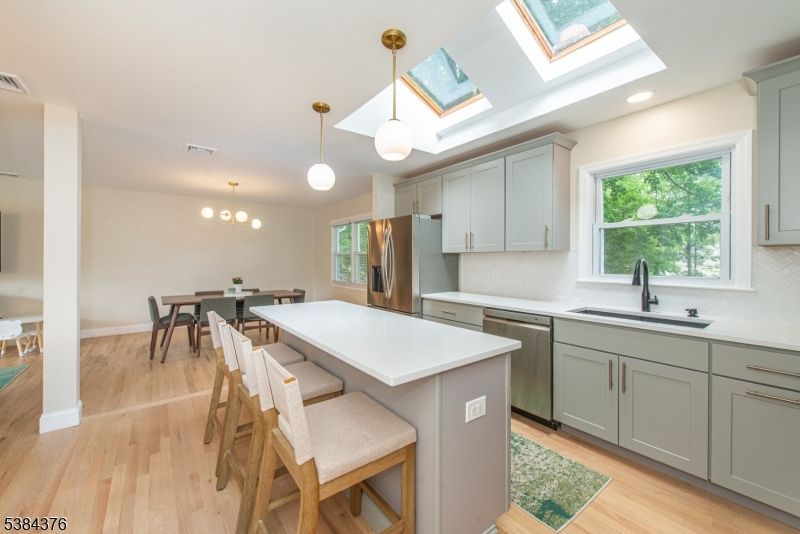 Dining room, Interior, Kitchen, Pendant Lights, Recessed Lighting, Stainless Steel Appliances, Wood Texture Flooring