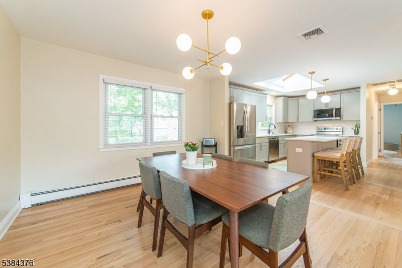 Dining room, Interior, Kitchen, Pendant Lights, Stainless Steel Appliances, Wood Texture Flooring