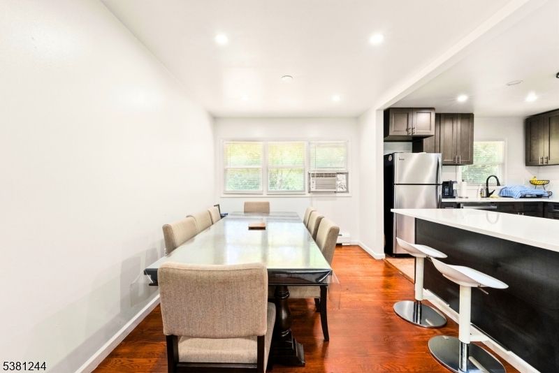 Dining room, Interior, Kitchen, Recessed Lighting, Stainless Steel Appliances, Wood Texture Flooring