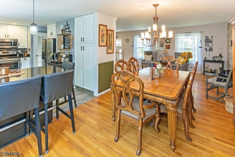 Chandelier, Dining room, Interior, Kitchen, Pendant Lights, Stainless Steel Appliances, Wood Texture Flooring