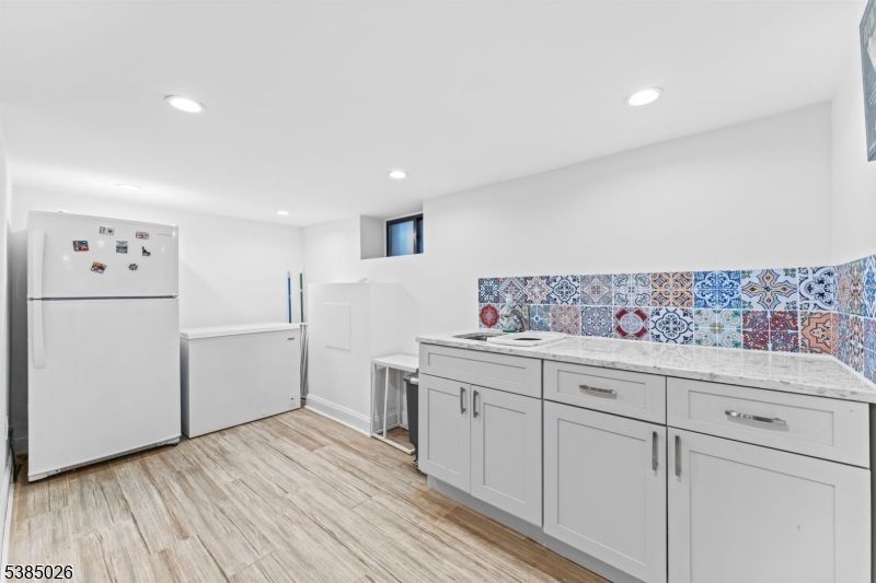 Interior, Kitchen, Recessed Lighting, Washer, Wood Texture Flooring