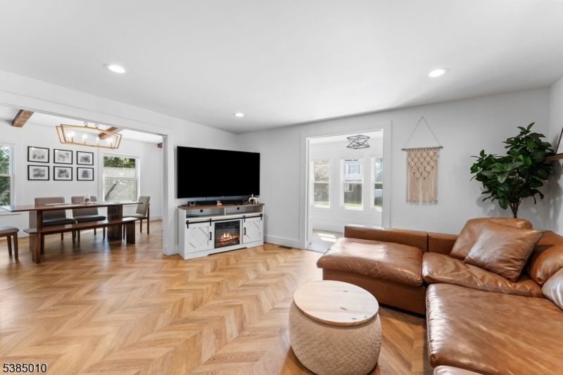 Dining room, Fireplace, Interior, Living room, Recessed Lighting, Wood Texture Flooring
