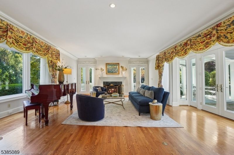 Fireplace, Interior, Living room, Piano, Recessed Lighting, Wood Texture Flooring