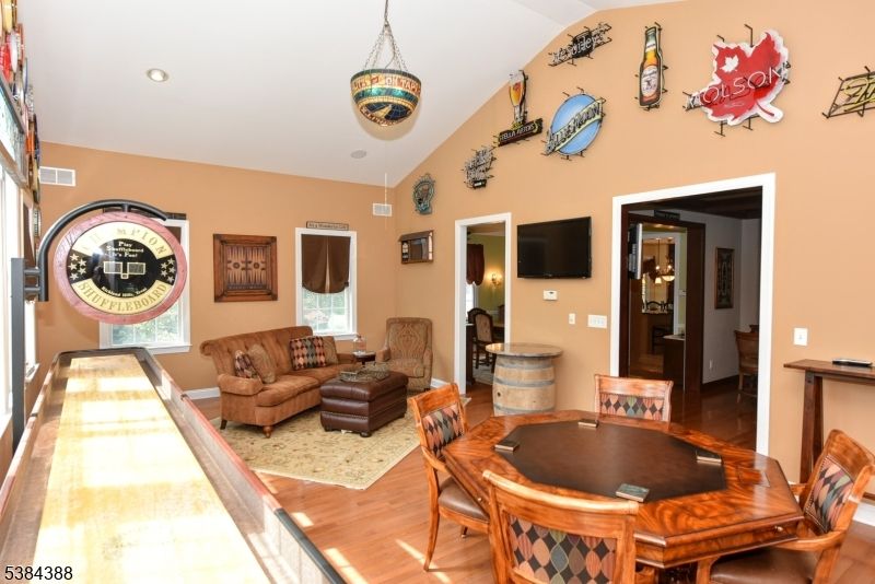Dining room, Game Room, Interior, Living room, Pendant Lights, Recessed Lighting, Wood Texture Flooring