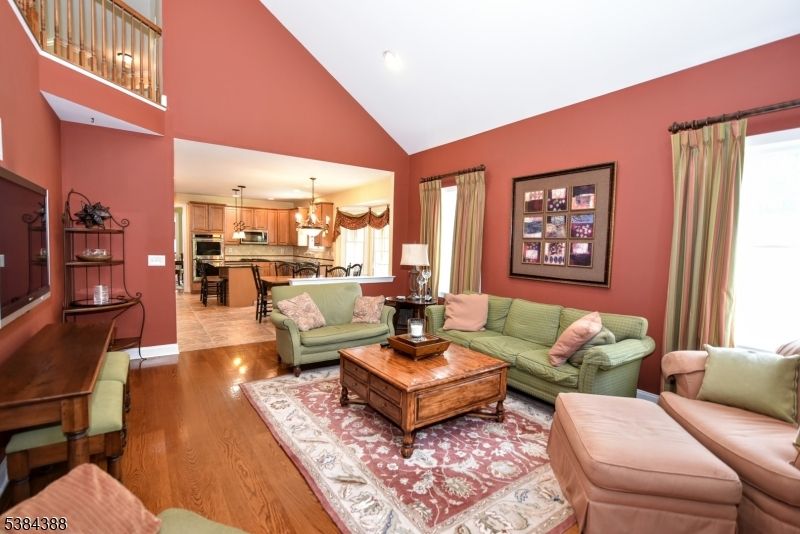 Chandelier, Interior, Kitchen, Living room, Pendant Lights, Recessed Lighting, Stainless Steel Appliances, Wood Texture Flooring
