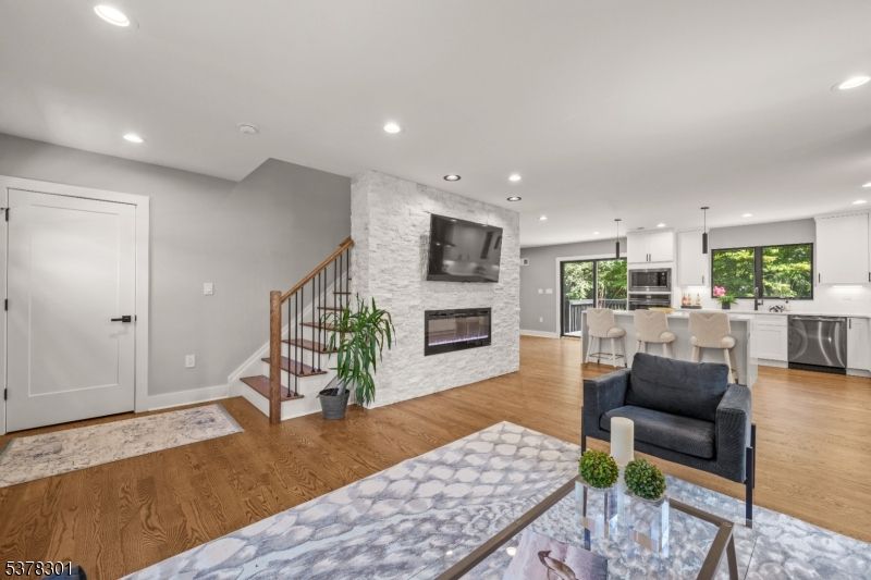 Dining room, Fireplace, Interior, Kitchen, Living room, Pendant Lights, Recessed Lighting, Stone Walls, Wood Texture Flooring
