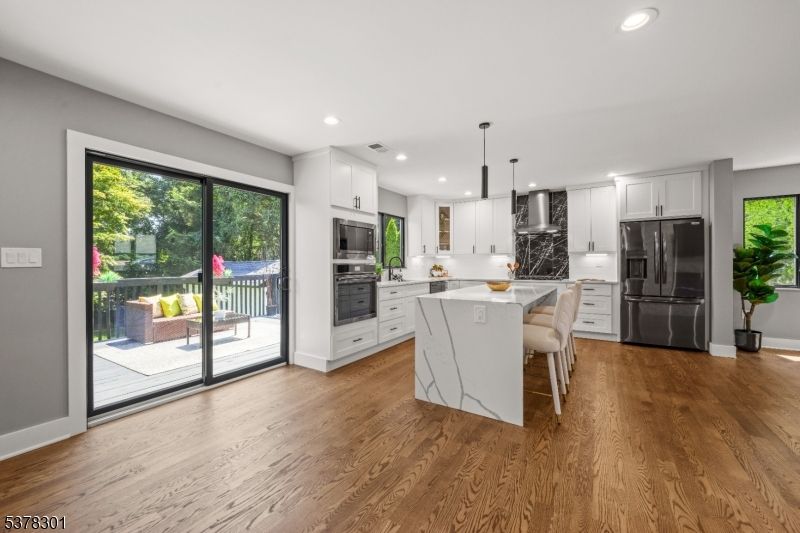 Dining room, Interior, Kitchen, Pendant Lights, Recessed Lighting, Stainless Steel Appliances, Wood Texture Flooring