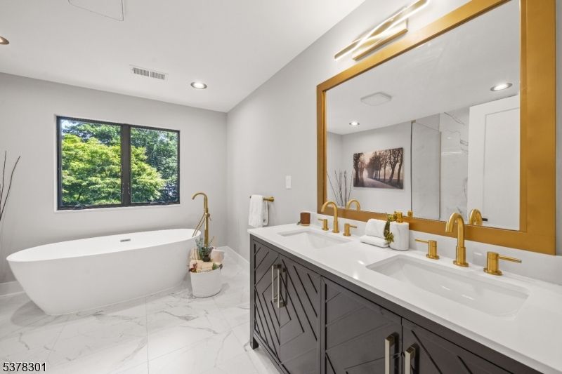 Bathroom, Dual Sink Vanities, Free Standing Baths, Interior, Marble, Marble Walls, Recessed Lighting