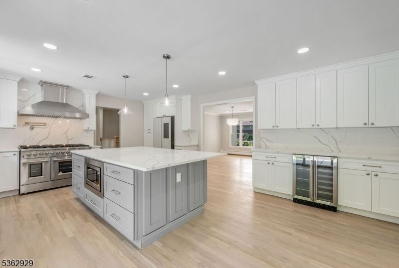 Interior, Kitchen, Marble Walls, Pendant Lights, Recessed Lighting, Stainless Steel Appliances, Wood Texture Flooring