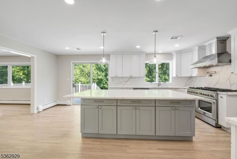 Interior, Kitchen, Marble Walls, Pendant Lights, Recessed Lighting, Stainless Steel Appliances, Wood Texture Flooring