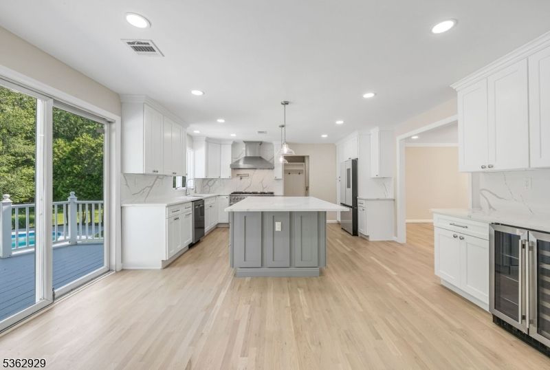 Interior, Kitchen, Marble Walls, Pendant Lights, Recessed Lighting, Stainless Steel Appliances, Wood Texture Flooring