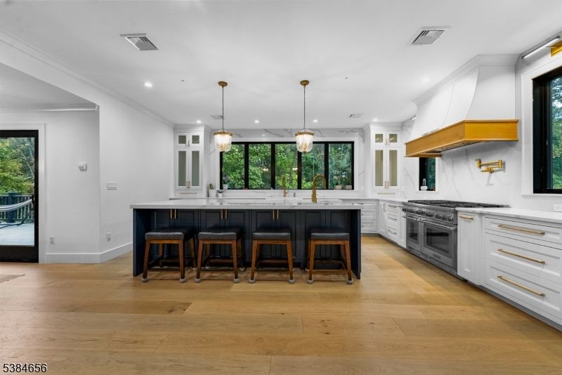 Interior, Kitchen, Marble Walls, Pendant Lights, Recessed Lighting, Stainless Steel Appliances, Wood Texture Flooring