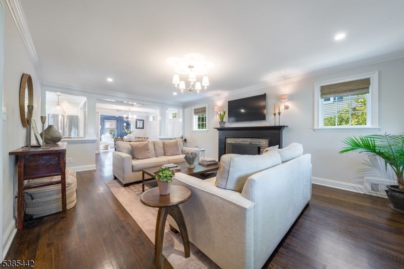 Chandelier, Fireplace, Interior, Living room, Pendant Lights, Recessed Lighting, Wood Texture Flooring