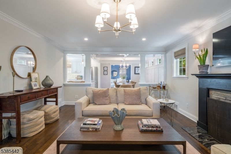 Chandelier, Dining room, Fireplace, Interior, Living room, Recessed Lighting, Wood Texture Flooring