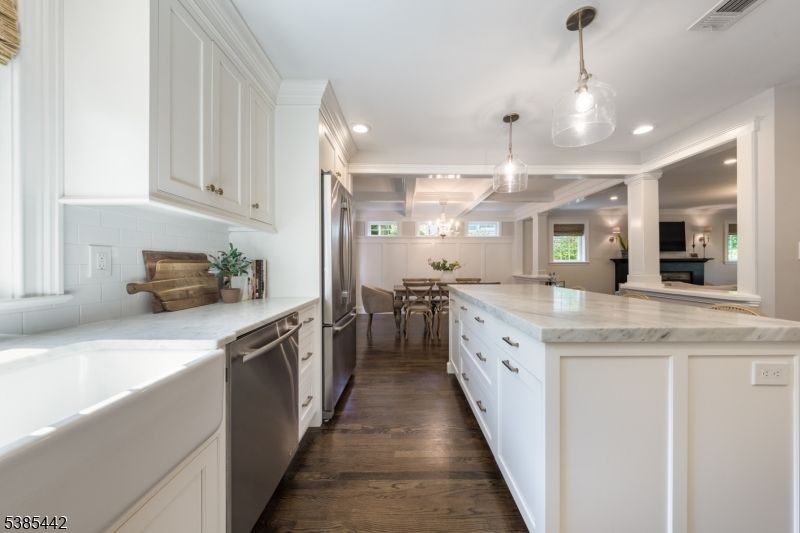 Chandelier, Dining room, Interior, Kitchen, Pendant Lights, Recessed Lighting, Stainless Steel Appliances, Wood Texture Flooring