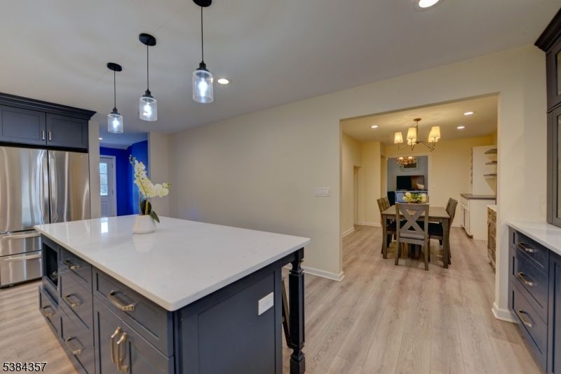 Chandelier, Dining room, Interior, Kitchen, Pendant Lights, Recessed Lighting, Stainless Steel Appliances, Wood Texture Flooring