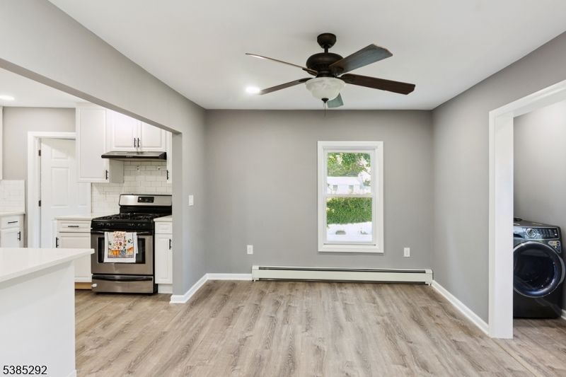 Interior, Kitchen, Recessed Lighting, Stainless Steel Appliances, Washer, Wood Texture Flooring