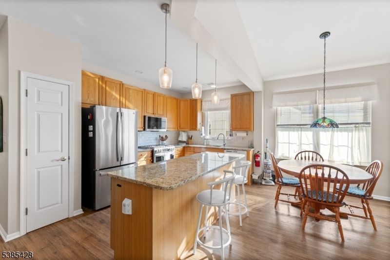 Dining room, Interior, Kitchen, Pendant Lights, Stainless Steel Appliances, Wood Texture Flooring
