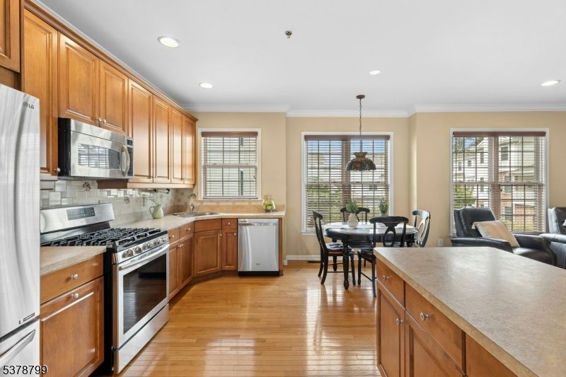 Dining room, Interior, Kitchen, Pendant Lights, Recessed Lighting, Stainless Steel Appliances, Wood Texture Flooring