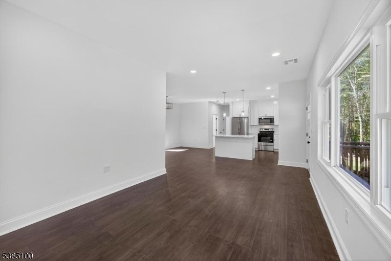 Empty room, Interior, Kitchen, Pendant Lights, Recessed Lighting, Stainless Steel Appliances, Wood Texture Flooring