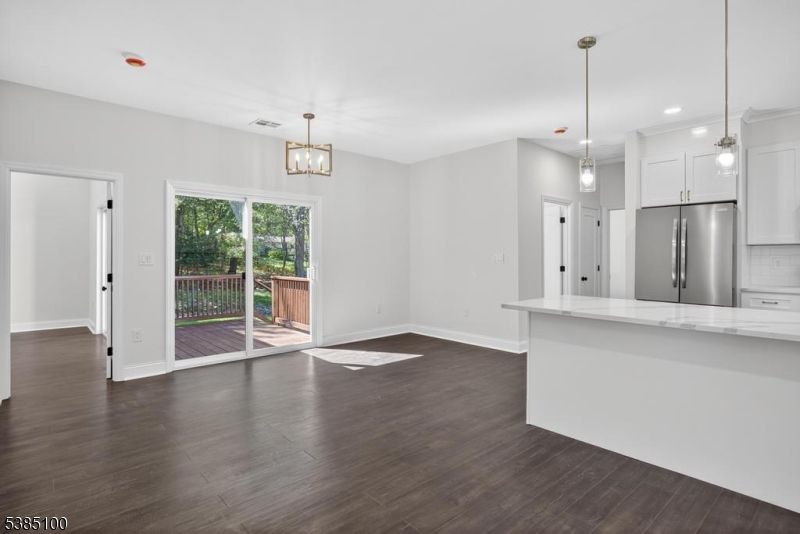 Empty room, Interior, Kitchen, Pendant Lights, Recessed Lighting, Stainless Steel Appliances, Wood Texture Flooring