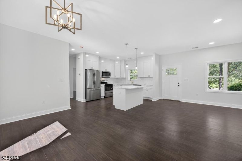 Empty room, Interior, Kitchen, Pendant Lights, Recessed Lighting, Stainless Steel Appliances, Wood Texture Flooring