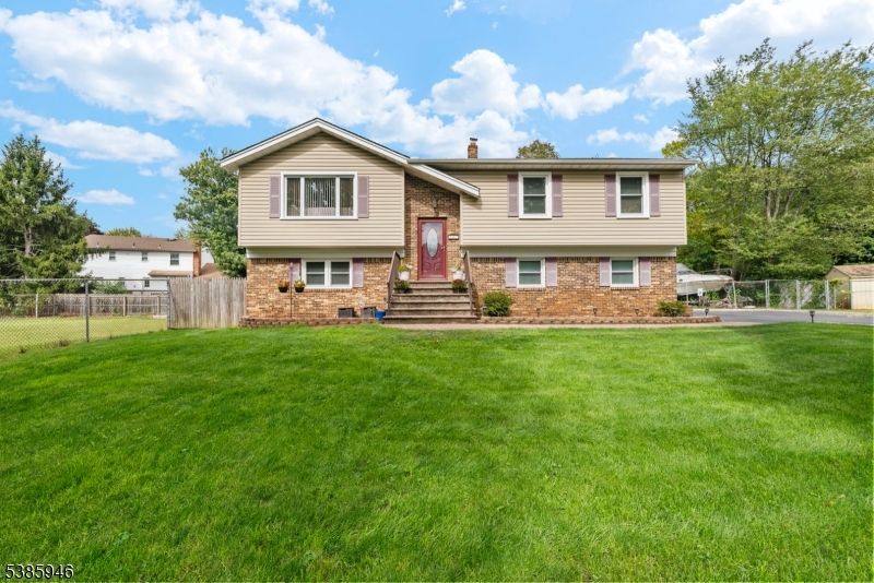 Backyard, Exterior, Facade, Brick Facade, Raised Ranch