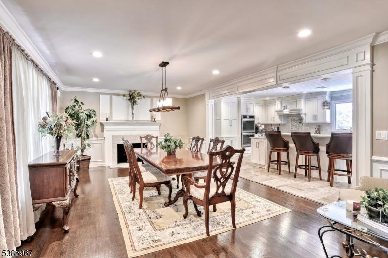 Dining room, Fireplace, Interior, Kitchen, Pendant Lights, Recessed Lighting, Stainless Steel Appliances, Wood Texture Flooring