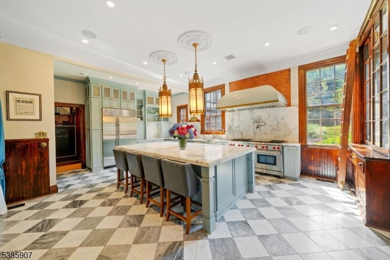 Interior, Kitchen, Marble Walls, Pendant Lights, Recessed Lighting, Stainless Steel Appliances