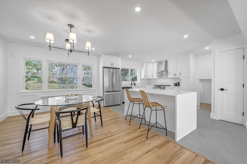 Chandelier, Dining room, Interior, Kitchen, Recessed Lighting, Stainless Steel Appliances, Wood Texture Flooring