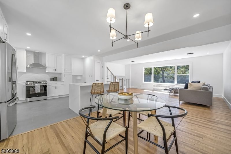 Dining room, Interior, Kitchen, Living room, Pendant Lights, Recessed Lighting, Stainless Steel Appliances, Wood Texture Flooring