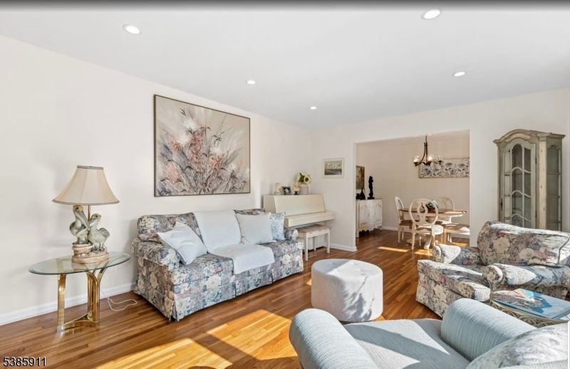 Chandelier, Dining room, Interior, Living room, Piano, Recessed Lighting, Wood Texture Flooring