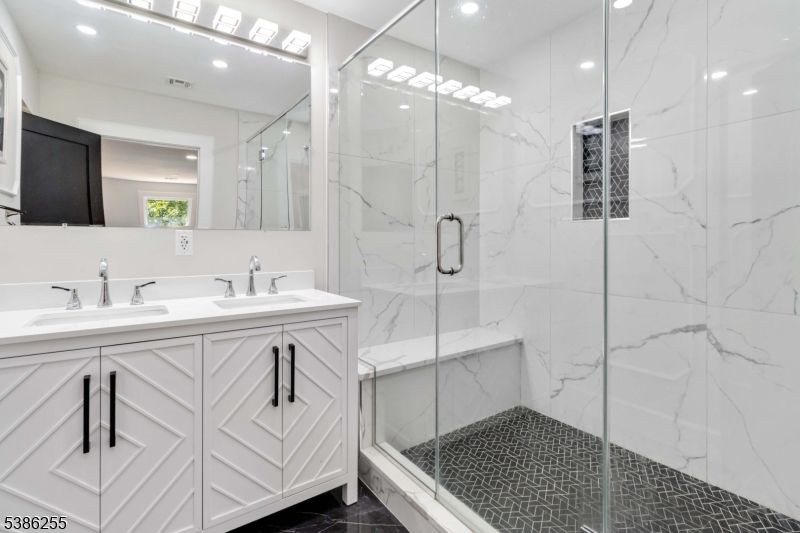 Bathroom, Dual Sink Vanities, Glass Shower, Interior, Marble Walls, Recessed Lighting