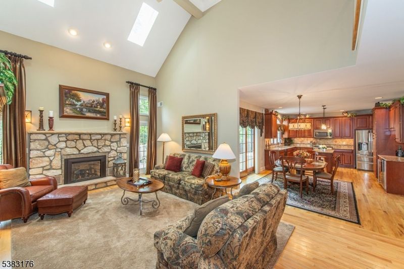 Dining room, Fireplace, Interior, Kitchen, Living room, Pendant Lights, Recessed Lighting, Stainless Steel Appliances, Wood Texture Flooring