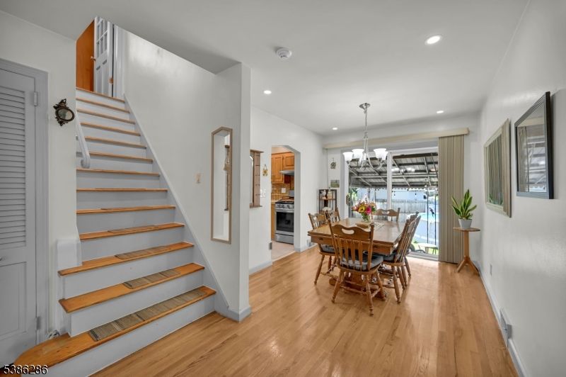 Chandelier, Dining room, Fireplace, Interior, Recessed Lighting, Wood Texture Flooring