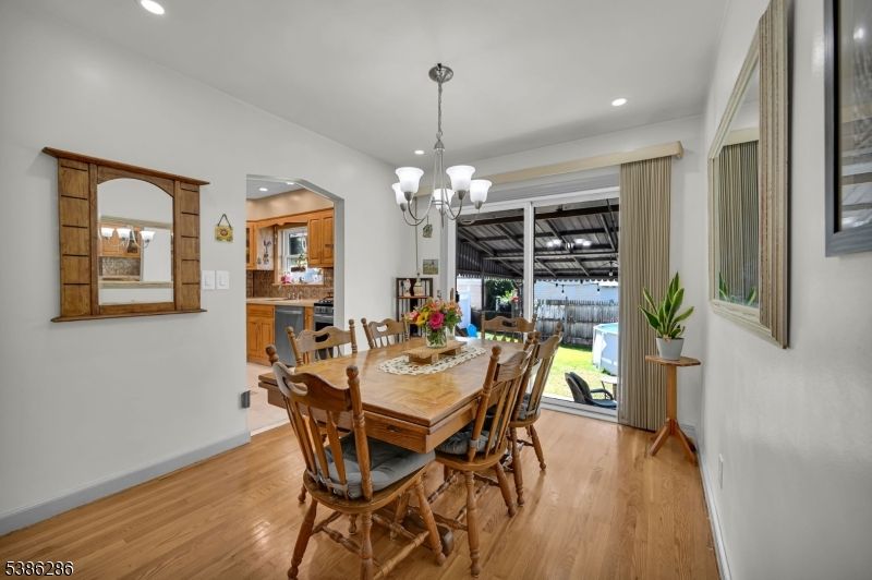 Chandelier, Dining room, Fireplace, Interior, Recessed Lighting, Wood Texture Flooring