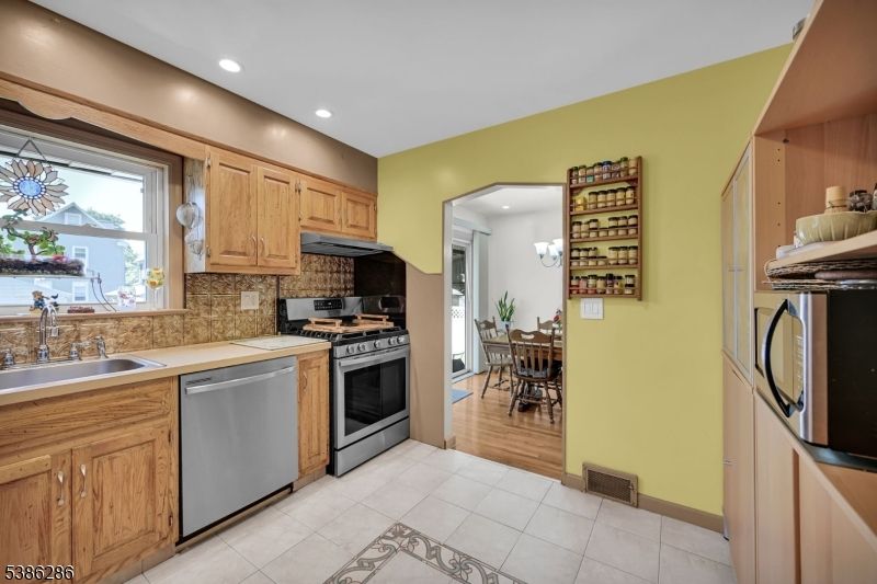 Dining room, Interior, Kitchen, Recessed Lighting, Stainless Steel Appliances, Wood Texture Flooring