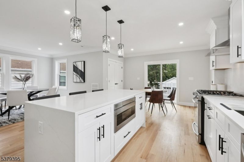 Dining room, Interior, Kitchen, Pendant Lights, Recessed Lighting, Stainless Steel Appliances, Wood Texture Flooring