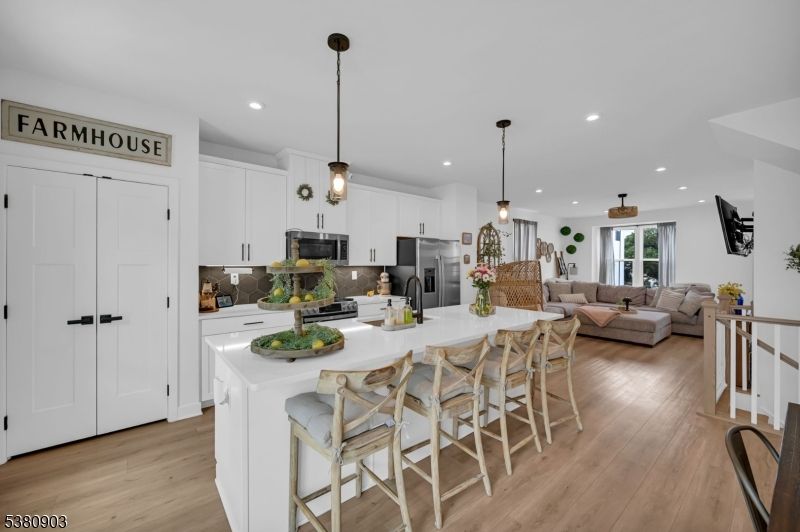 Dining room, Interior, Kitchen, Living room, Pendant Lights, Recessed Lighting, Stainless Steel Appliances, Wood Texture Flooring
