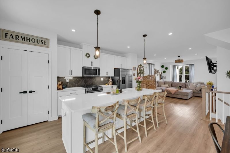 Dining room, Interior, Kitchen, Living room, Pendant Lights, Recessed Lighting, Stainless Steel Appliances, Wood Texture Flooring