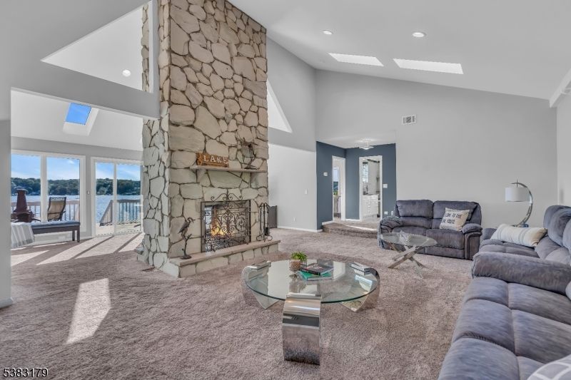 Fireplace, Interior, Living room, Recessed Lighting, Stone Walls, Water