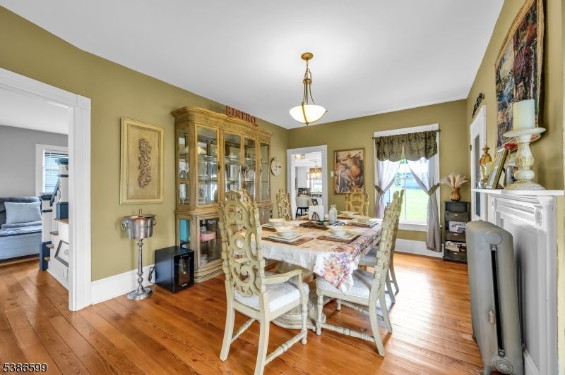 Dining room, Fireplace, Interior, Pendant Lights, Wood Texture Flooring