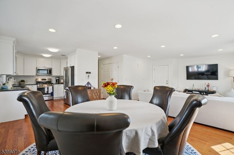 Dining room, Interior, Kitchen, Living room, Recessed Lighting, Stainless Steel Appliances, Wood Texture Flooring