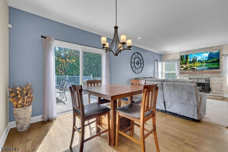 Dining room, Fireplace, Interior, Living room, Pendant Lights, Recessed Lighting, Wood Texture Flooring